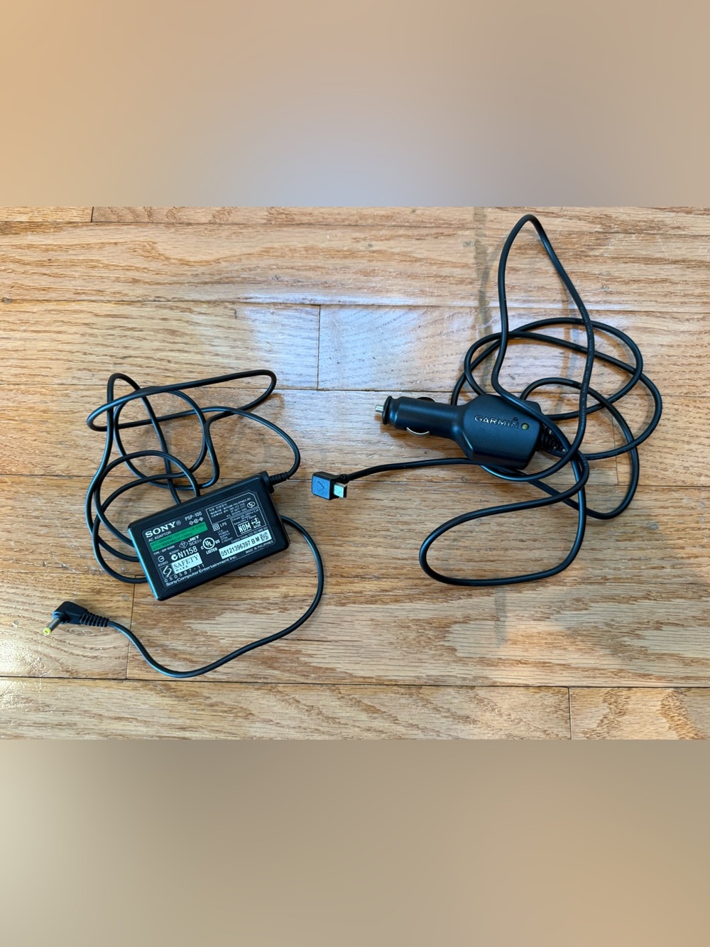 2 adapters 1 garmin car 14509027008 and 1 Sony 5v 2000mA ac adapter psp-100